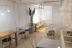 an empty restaurant with tables and chairs