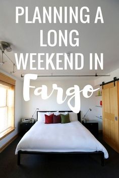 a white bed sitting in a bedroom next to a wooden door and window with the words planning a long weekend in fargo written on it