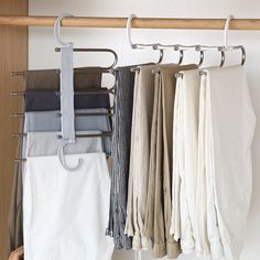 a rack with clothes hanging from it's sides