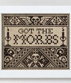 a cross stitch pattern with the words go to the store on it and an image of candles