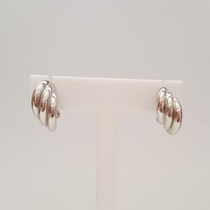 18kt White Gold Triple Hoop Earrings, Like New Condition, 19mm Long x 9.2mm Wide, 4.8 Grams, Friction Post w/ Omega Backing, Hollow. Beautiful earrings that are versatile and timeless in design. Stamped 750. 4.8 grams. Please let us know if you have any questions. Rock N Gold Estates has 30 years of experience selling fine estate jewelry. Simon M., owner and founder of Rock N Gold Creations, is a graduate of the Gemological Institute of America. Modern Clip-on Huggie Earrings, Modern Hallmarked Huggie Earrings, Formal White Gold Clip-on Hoop Earrings, Modern Clip-on Hoop Huggie Earrings, Modern Polished Clip-on Earrings For Anniversary, Modern Hallmarked Hoop Earrings, Modern Polished Round Clip-on Earrings, Modern Polished Finish Round Clip-on Earrings, Modern Round Clip-on Earrings For Anniversary