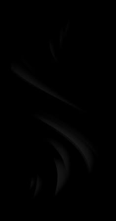 an abstract black and white photo with wavy lines in the dark, on a plain surface