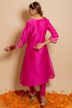 Fuchsia chanderi silk A-line kurta with embroidered gota details. Comes with embroidered pants. Paired with embroidered organza dupatta.
Component: 3
Pattern: Embroidered
Type Of Work: Gota,pearl,zardozi 
Neckline: Round
Sleeve Type: Three quarter
Fabric: Silk chanderi, organza, Lining: Cotton shantoon
Color: Fuchsia
Other Details: 
Kiran lined sleeves
Side gota embroidery panels
Lace embroidered bodice
Lining attached
Occasion: Mehendi and Haldi,Sangeet - Aza Fashions Designer Pink Tussar Silk Anarkali Set, Designer Pink Tussar Silk Kurta, Pink Tussar Silk Kurta With Traditional Drape, Tussar Silk Straight Kurta Dress, Traditional Drape Pink Tussar Silk Kurta, Festive Pink Tussar Silk Kurta, Pink Unstitched Tussar Silk Kurta, Unstitched Pink Tussar Silk Kurta, Semi-stitched Pink Tussar Silk Kurta