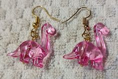 dinosaur earrings they are so cute Dinosaur Earrings, Pink Dinosaur, Jewelry Earrings Dangle, So Cute, Etsy Earrings, Dangle Drop Earrings, Dangle Earrings, Accessory Gift, Jewelry Earrings