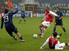 soccer players in action on the field during a game