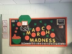 a bulletin board with basketballs and hoop on it