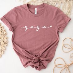 Cute Yoga Shirt! This shirt is the perfect tee for yoga classes and for everyday wearing. Beautiful gift for a friend or for treat yourself, this shirt has a  cute and minimalist design, with a powerful practice: YOGA ❤ * DETAILS: T-shirts: Bella + Canvas - super soft and high quality shirts Material: Cotton/Poly Blend Design: is applied using high quality heat transfer vinyl and is applied to each shirt with a commercial grade heat press. Model: Unisex Sleeves: they are rolled up for display purposes only Printed in the USA *SIZING For sizing, please refer to the size chart in the pictures or contact us. Our t-shirts are unisex. Women should order one (1) size down if they prefer a slimmer fit. Size chart is included in images. *COLORS Color chart is available in images with all colors av Cotton Yoga Activewear, Short Sleeve Athleisure Tops For Relaxation, Sporty Short Sleeve Tops For Relaxation, Sporty Yoga T-shirt With Letter Print, Cotton Relaxed Fit Top For Meditation, Athleisure T-shirt With Letter Print For Loungewear, Cotton Comfortable Fit T-shirt For Workout, Cotton Athleisure Yoga Tops, Cotton Athleisure Tops For Yoga