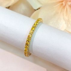 "Half Eternity Band Ring with Natural Citrine Gemstones. MaterialSolid Gold (14K/18K) or Platinum 950 PlatingRhodium/ Platinum Family (Only if white gold selected) FinishHigh Polished/ Shiny SettingU Micro Pave (Reminds the letter \"U\" from sides) StoneNatural Citrine Shape and CutRound, Diamond Cut Total Carat Weightapx 0.40+ ct Quantity of Stonesapx 19 (varies by ring size) QualityAAA Width2 mm Click below to add laser engraving. https://www.etsy.com/listing/631070916/laser-engraving?ga_searc Gold Gemstone Eternity Band For Promise, Gold Eternity Band With Gemstone For Promise, Promise Eternity Band In Yellow Gold With Cubic Zirconia, Yellow Halo Jewelry For Anniversary, Yellow Gold Gemstone Eternity Band, Yellow Gold Eternity Band With Gemstone, Yellow Stackable Promise Ring, Yellow Gold Cubic Zirconia Bands As Gift, Yellow Gold Gemstone Eternity Band For Anniversary