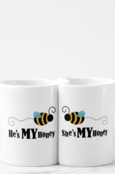 two coffee mugs with the words he's my honey and she's my honey