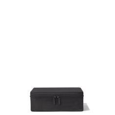 an empty black box sitting on top of a white surface with the lid open and it's handles closed