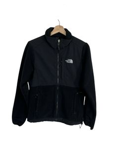 The North Face Denali Jacket Womens Small Black Polartec Full Zip  Great preowned condition. The pockets have holes on the inside and there is light fabric wear on the inside of the jacket but the outside in in great condition.  Approximate Measurements(in inches, laying flat): Please compare measurements with a similar item that fits you well. Shoulder to shoulder: 15.5" Pit to pit: 19.5" Fron length: 24.5" Back length: 25.5" Waist: 17.5" Sleeve: 25.5" Please remember all clothing items may fit Functional Black Fleece Jacket For Streetwear, Black Functional Fleece Jacket For Streetwear, The North Face Fleece Jacket With Pockets For Streetwear, Functional Black Fleece Jacket With Pockets, Black Fleece Jacket With Pockets For Outdoor, Black Outdoor Fleece Jacket With Pockets, The North Face Black Techwear Outerwear, Black The North Face Techwear Outerwear, Black Techwear Outerwear By The North Face