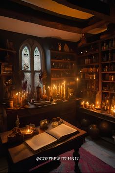 a room filled with lots of candles next to a book on top of a table