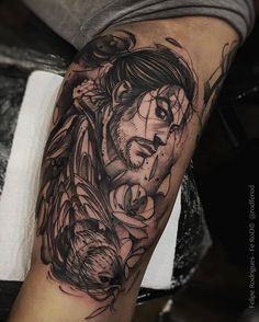 a man's arm with a tattoo on it that has an image of a woman and flowers