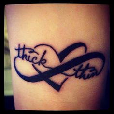 a tattoo with the word luck and two hearts on it