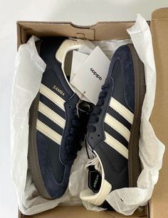 a pair of adidas sneakers in a box