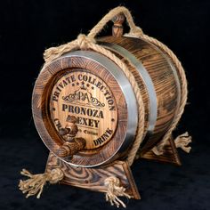 a wooden barrel with rope hanging from it's sides on a black background,