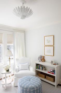 a white chair and ottoman in a room