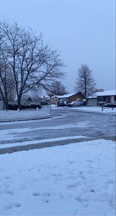 an empty street with snow on the ground