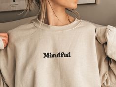 This mindful positive affirmation sweatshirt is the perfect way to encourage mindfulness in your life. Whether it's for yoga, meditation, or just lounging at home, this hoodie has everything you need to stay fashionable, comfortable, and mindful. The meaningful affirmation ‘breathe in breathe out’ on the sleeve helps to remind us that, despite whats happening in our life, staying focused on the present is the best we can do. An excellent wellness-inspired gift for yourself or a loved one, this s Oversized Sweatshirt For Relaxation, Oversized Crew Neck Sweatshirt For Relaxation, Fall Relaxation Crew Neck Sweatshirt, Comfortable Cotton Sweatshirt For Relaxation, Fall Crew Neck Sweatshirt For Relaxation, Casual Crew Neck Sweatshirt, Oversized Athleisure Sweatshirt For Relaxation, Casual Cotton Sweatshirt For Relaxation, Cotton Athleisure Sweatshirt For Relaxation