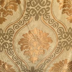 an ornate gold and silver wallpaper with intricate designs on the fabric, as well as other decorative elements