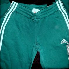 Condition: Brand New With Tags Size: Womens Small Adidas Collegiate Green/White Stripe Joggers Reg Price: $50 Send Your Best Offer No Exchanges/Returns/ Refunds Or Trades Bundle With Other Items From My Closet For An Offer! Smoke Free Home Casual Green Bottoms With Three Stripes, Green Sportswear Bottoms With Three Stripes, Casual Three Stripes Joggers For Loungewear, Green Bottoms For Jogging In Spring, Casual Joggers With Three Stripes Branding For Loungewear, Green Cotton Tracksuit With Pockets, Green Bottoms For Spring Jogging, Casual Sweatpants With Three Stripes Branding, Cotton Three Stripes Joggers For Spring