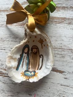 Hand-cleaned and hand-painted oyster shell ornament. Strung from a satin gold ribbon. Varnished with a high gloss varnish. Each ornament is made to order. Shell Quotes, Christmas Ornaments 2022, Sand Dollar Art, Dollar Art, Oyster Ornament, Shells Diy