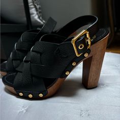 Black Platforms Black Leather Sandals With Gold-tone Hardware, Black Open Toe Heels With Gold-tone Hardware, Formal Black Sandals With Gold-tone Hardware, Designer Black Heels With Wooden Heel, Designer Black Heels With Buckle Closure, Black Platforms, Pink Orchids, Black Platform, Tory Burch Shoes