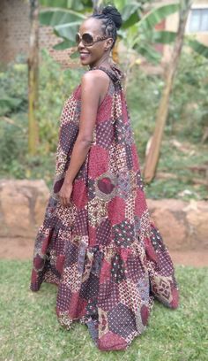 "If you're looking for an elegant African print dress for a special occasion, then this A-line maxi dress is for you. It has a bias cut A line bodice with an extravagant flounce at the bottom. Made in 100% cotton fabric.  Available in Large size. Full dress length 60\". Halter neck with strap ties. No pockets. It fits up to bust measurements 45 inches.  Kindly note that due to variations in computer monitors, tablets and/or mobile device settings, actual fabric colours may slightly differ from t Bohemian A-line Maxi Dress With Ruffles, Flowy A-line Bohemian Maxi Dress, Flowy Printed Floor-length Maxi Dress, Printed A-line Maxi Dress, Multicolor Ruffled Floor-length Maxi Dress, Flowy Floor-length Printed Dress, Flowy Multicolor A-line Maxi Dress, Flowy Patterned Printed Maxi Dress, Flowy Patterned Maxi Dress