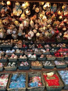 baskets full of different types of christmas ornaments