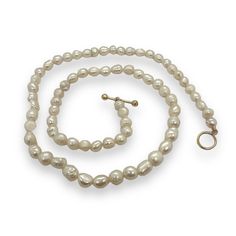 Lustrous 5mm sustainably grown, white pearls on a white silk, hand-tied line. This 14” length choker exudes timeless elegance, while still being on trend. The 14k gold toggle adds a touch of luxury, creating a sophisticated piece that can be stylishly layered with other necklaces and chains for a trendy and versatile look. White Silk, Pearl White, Timeless Elegance, Choker, Necklaces, Silk, Chain, Gold, White