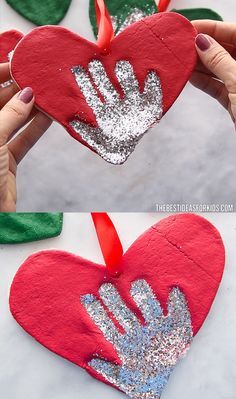 someone is making a handprinted heart ornament with glitter and red ribbon