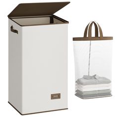 a white trash can next to a brown and white bag