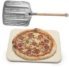 a pizza on a white plate with a spatula next to it