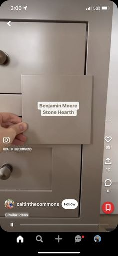 someone inserting stickers on the front of a refrigerator