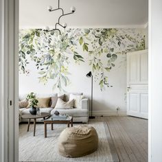 the living room is decorated with floral wallpaper