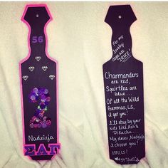 two wine bottle shaped signs with writing on them