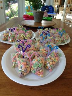 some heart shaped treats are sitting on plates