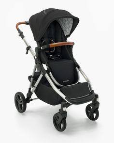 the stroller is black and silver with a wooden handle on it's wheels