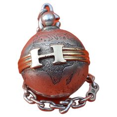 Rare Authentic Hermès Charm or Keychain In shape of a Globe Can be used as Bag Charm or Key Ring Made of Silver (minerva hallmark) The globe is belted in golden with an "H" buckle Vintage item Colorway: silvery and golden "HERMES PARIS" engraved at bottom (a bit erased) Hallmarks on the chain Measurements: - Globe is around 2,3 cm diameter (0,9 inch) - Total length open: 15,5 cm (6,1 inches) - Total length closed: 8,5 cm (3,34 inches) Condition: Good. Origina shape. No missing part. Signs of use Hermes Helmet, Hermes Alchemy, Hermes Charm, Hermes Horse Charm, Felt Pouch, Hermes Cheval D'orient, Key Holder, Globe, Key