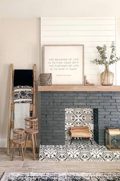 a living room filled with furniture and a fire place in front of a brick fireplace