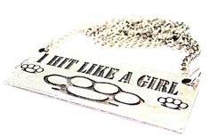 a dog tag that says i'm like a girl with paw prints on it