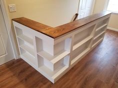 a wooden counter top sitting on top of a hard wood floor