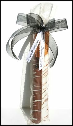 a baguette wrapped in clear cellophane and tied with a ribbon