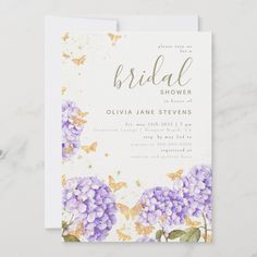 the bridal shower is shown with purple flowers and butterflies