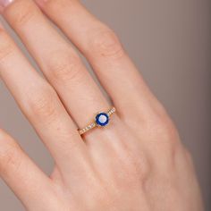 A classic engagement sapphire ring in 14K solid gold with one deep blue sapphire and 10 diamonds brilliant cut. A perfect gold wedding ring. 100% handcrafted with love! This listing refers only to the sapphire engagement ring. D E T A I L S ● Metal: 14K solid gold ● Gemstone: Blue Sapphire, Diamonds, brilliant cut ● Gemstone Weight: Sapphire 0.80ct, white diamonds 0.07ct R I N G ∙ S I Z I N G For General Reference: ● we use standard US Ring Sizing ● an average women's ring finger is size 6-7 ● e Classic Wedding Ring, Blue Sapphire Engagement Ring, Classic Engagement, Classic Wedding Rings, Sapphire Engagement Ring Blue, Sapphire Engagement Ring, Gold Wedding Rings, Classic Wedding, Sapphire Engagement