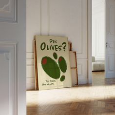 there is a sign that says do you have olives? on the floor in an empty room