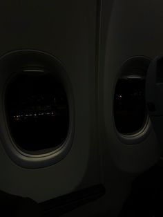 the view from inside an airplane window at night