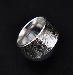 This is a simple but beautifully patterned art deco hourglass ring, providing a glimpse of a bygone era. Perfect for all occasions, standing alone or paired with other rings. Our jewelry is hand crafted in the USA using timeless techniques passed down through generations. Width: 1/2 inch (13 mm) Materials: Solid Sterling Silver Hourglass Ring, Laguna Niguel, Standing Alone, Bygone Era, Ring Sterling Silver, Pattern Art, Band Rings, Sterling Silver Rings, Jewelry Rings