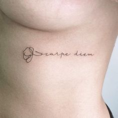 a woman's stomach with the word carpe dien written on her left side