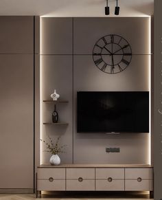 a living room with a large clock mounted on the wall above it's entertainment center